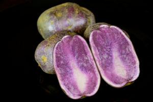 Most of us are used to eating the typical white or yellow variety of this nightshade vegetable…